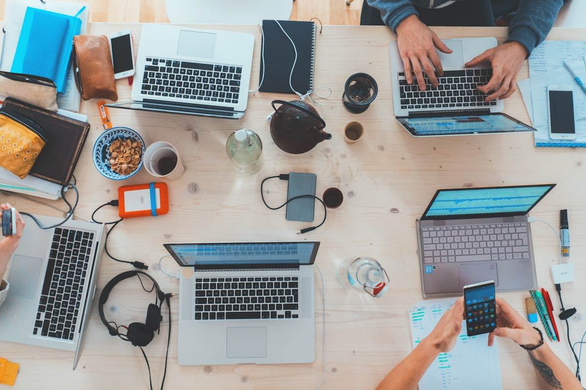 Shared desk with laptops